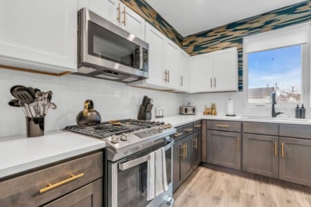 White kitchen with grey details.