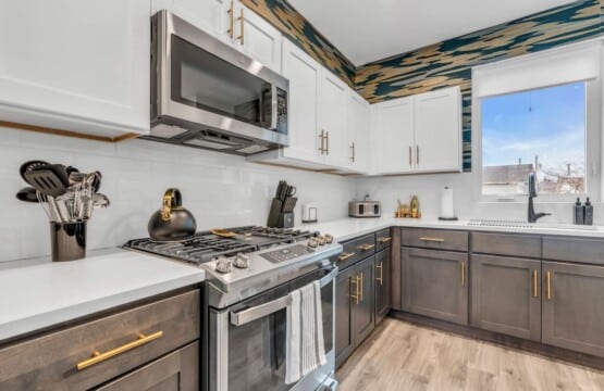 White kitchen with grey details.