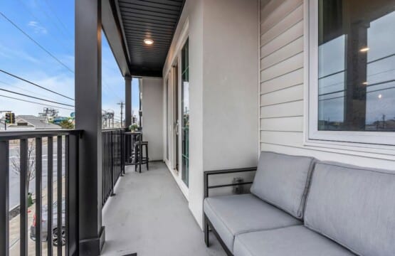 Balcony terrace showing peaceful Jersey neighborhood street view.
