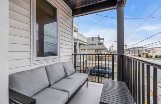 Balcony terrace showing peaceful Jersey neighborhood street view.