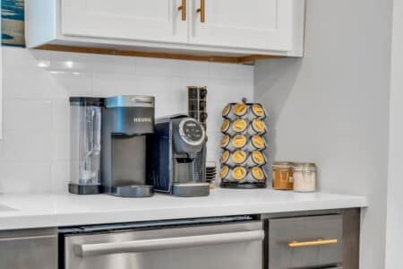 Mini coffee station setup with cups and machine.