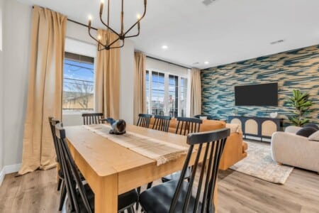 Dining and living area with large windows offering a beautiful view.