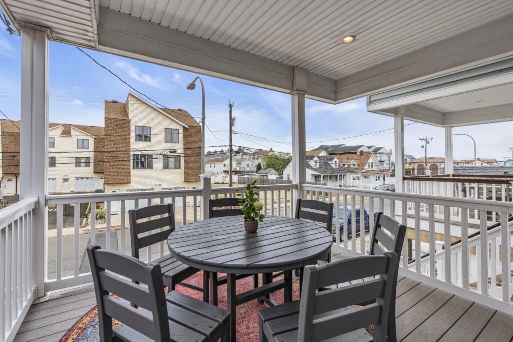 Looking a Jersey neighborhood with a table and vase holding a green plant.