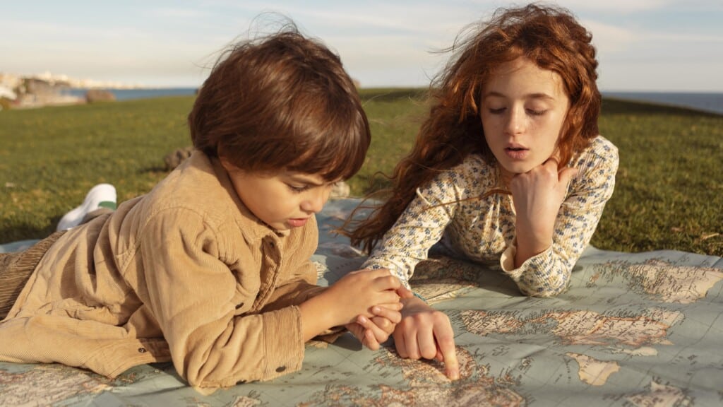 medium shot kids looking map