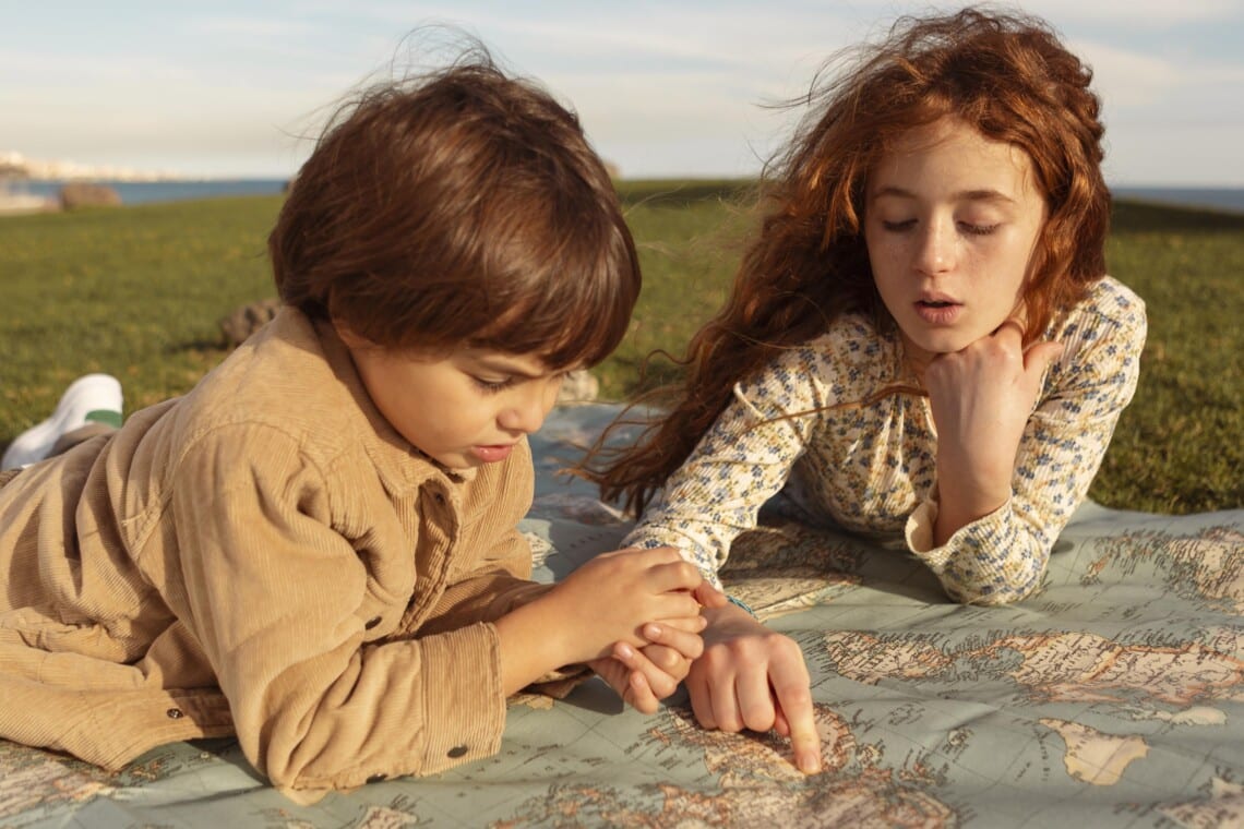 medium shot kids looking map